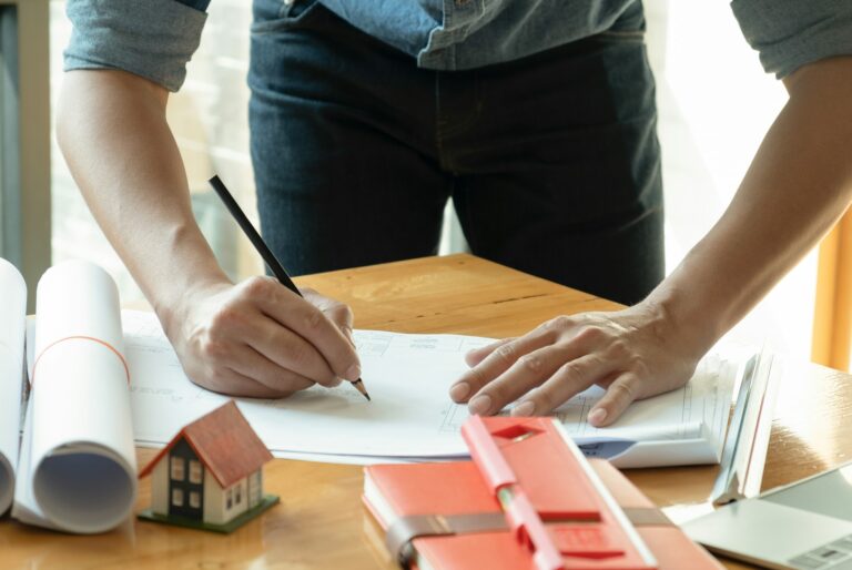 Architects write home designs on the desk.